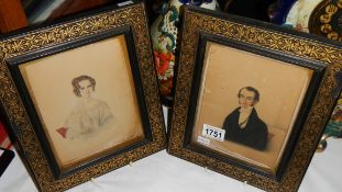 A pair of framed and glazed portraits of a lady and gentleman.