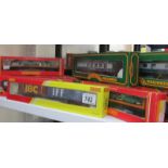 A quantity of Hornby '00' Golden Arrow Pullman coaches and car transporters, (14 pieces).