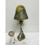 An art nouveau table lamp with glass shade signed Galle' (Emile Galle', 1846-1904).