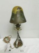 An art nouveau table lamp with glass shade signed Galle' (Emile Galle', 1846-1904).