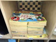 A box of Beano and Dandy comics and chess set