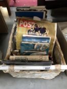 A wicker basket full of various books (many on aircraft)