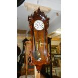 A double weight Vienna wall clock in ornate case.