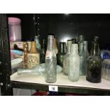 A small collection of glass & stoneware bottles,