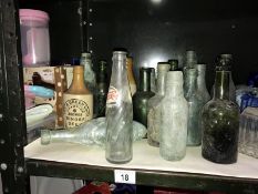 A small collection of glass & stoneware bottles,