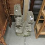 A double head statue similar to the Easter Island figures,.