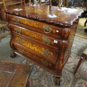 A marquetry inlaid 4 drawer bombe chest.