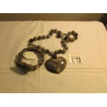 A Lola Rose grey agate heart necklace and bracelet.