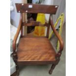 A Victorian mahogany elbow chair.