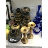 7 assorted brass & copper oil lamp vessels/base together with a pair of brass candlesticks,