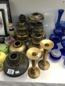 7 assorted brass & copper oil lamp vessels/base together with a pair of brass candlesticks,