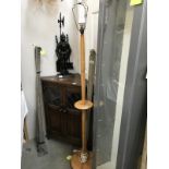 A turned wood lamp stand