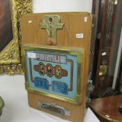 A vintage fair ground slot machine.
