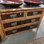 A bamboo 2 over 2 chest of drawers.