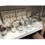 A collection of Beatrix Potter Wedwood nursery ware including plates, cups,