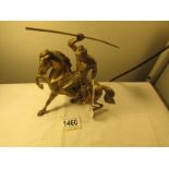 A heavy brass horse surmounted warrior.