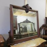 A mahogany over mantel mirror.