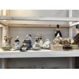 A collection of miscellaneous figurines including musical etc.