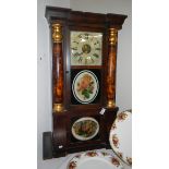 An inlaid American wall clock with sloping front and painted flowers.