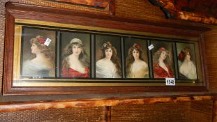 A framed and glazed set of 6 Edwardian lady cards.