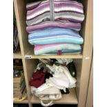 A quantity of ladies cardigans (some new) and a shelf of scarves, gloves etc.