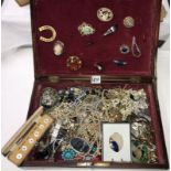 A box of assorted costume jewellery.