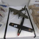 2 hand made children's toys being V1 Buzz Bomb and bomber aircraft.