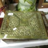 A heavy brass desk blotter,