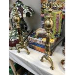 A pair of large brass & iron fire dogs