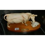 A Royal Doulton Charolais cow and calf.