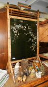 A bamboo firescreen inset with bird decorated glass panel.