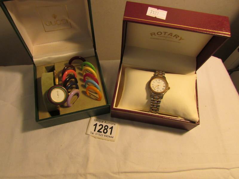 A Rotary Sapphire wrist watch and a Gucci wrist watch with interchangeable bezels.