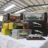 A collection of boxed large scale die cast model cars and a pewter E type Jaguar.