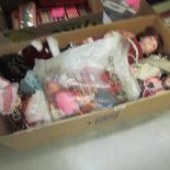 A box of assorted dolls.