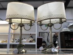 A pair of double table lamps