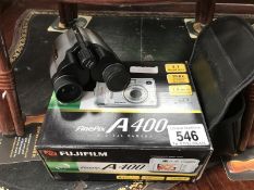 A boxed digital camera and a cased set of binoculars