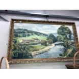 A framed oil on canvas of a river scene