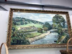 A framed oil on canvas of a river scene