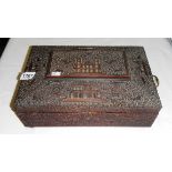 A superb quality oriental carved sewing box complete with interior fittings