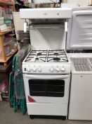 A New World gas cooker with overhead grill