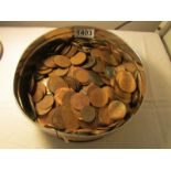 A box of British copper pennies and half pennies.