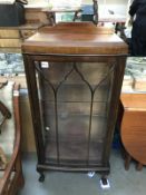 An astragal glazed display cabinet with pointed Gothic arch decoration