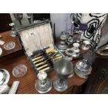 A mixed lot of metalware including cutlery set, candlesticks, cruet stand etc.