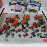 A quantity of play worn tractors by Dinky, Britain's, Liliput etc.