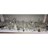 A shelf of small glass ornaments mostly dogs,