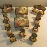 A collection of 13 pieces of Austrian enamel miniature furniture.