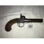 A small old percussion pistol in good condition,