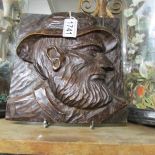 A carved wood wall plaque being the head of a seafarer.