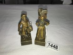 A pair of rare bronze figures of a Fisherman and a Fishwife on bases, Man 10cm and woman 11cm tall.