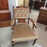 An Edwardian mahogany inlaid arm chair.